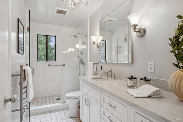16 Ivy Ln, Woodacre, CA 94973 - full bathroom with a stall shower, vanity, toilet, and a chandelier