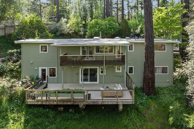 16 Ivy Ln, Woodacre, CA 94973 - rear view of house featuring a deck, view of scattered trees, and a balcony