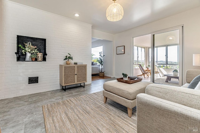 living room with a fireplace, baseboards, and recessed lighting