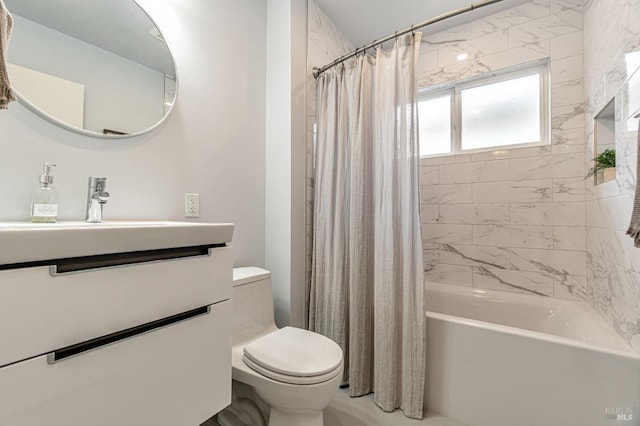 bathroom with toilet, shower / tub combo, and vanity