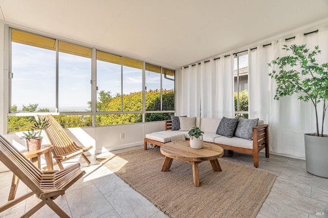 sunroom featuring outdoor lounge area