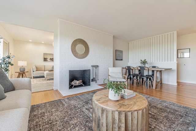 living area with wood finished floors and a fireplace