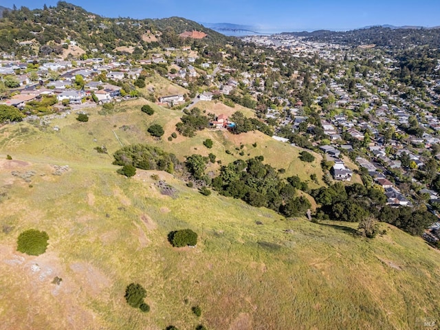 aerial overview of property's location featuring nearby suburban area and mountains