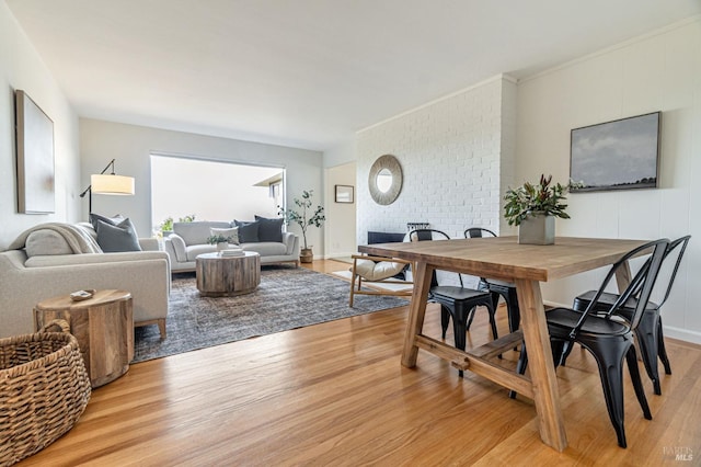 dining room with light wood-style flooring
