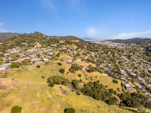 view of property location featuring nearby suburban area and mountains
