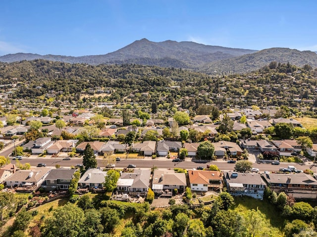aerial view of residential area featuring mountains