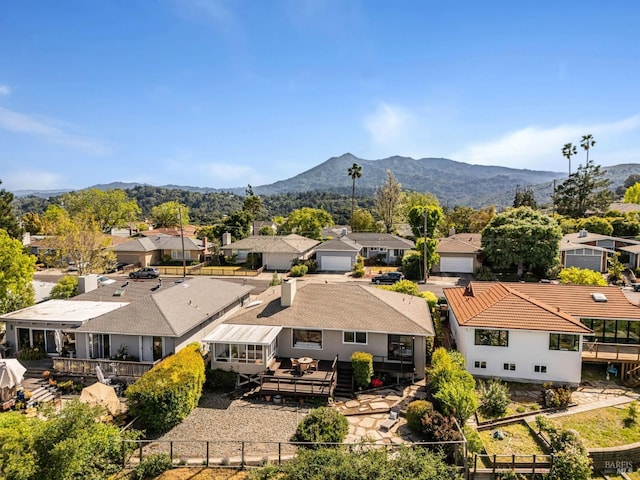 aerial view of residential area featuring a mountain backdrop