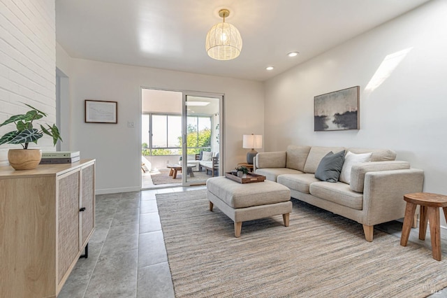living area with recessed lighting and light tile patterned floors