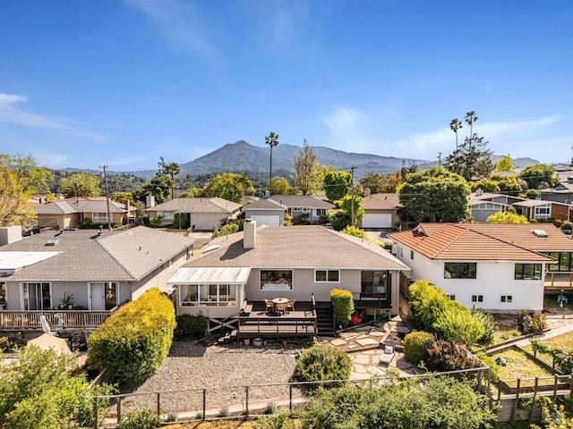 aerial view of residential area featuring mountains