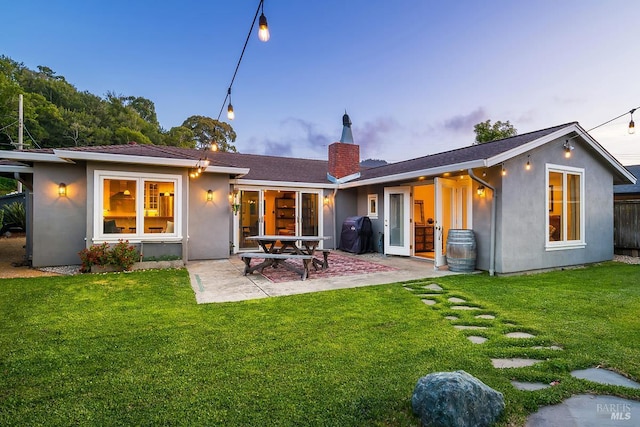 229 Cardinal Rd, Mill Valley, CA 94941 - rear view of house with stucco siding, a patio, and a chimney