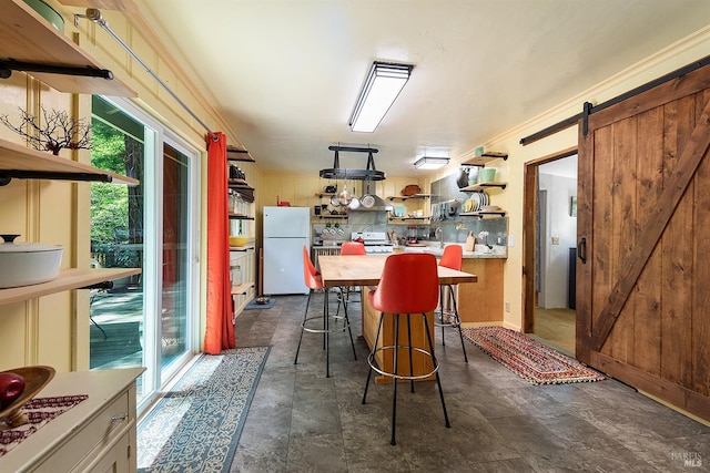 10 Wildwood Ln, Cazadero, CA 95421 - dining room with healthy amount of natural light, a barn door, and stone finish flooring