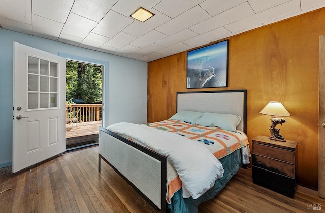 10 Wildwood Ln, Cazadero, CA 95421 - bedroom with access to exterior, wood-type flooring, and wood walls