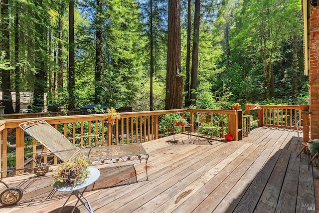 10 Wildwood Ln, Cazadero, CA 95421 - wooden terrace featuring a view of trees