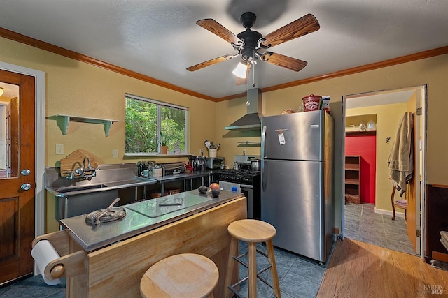 10 Wildwood Ln, Cazadero, CA 95421 - kitchen with stainless steel appliances, wall chimney range hood, crown molding, stainless steel counters, and ceiling fan