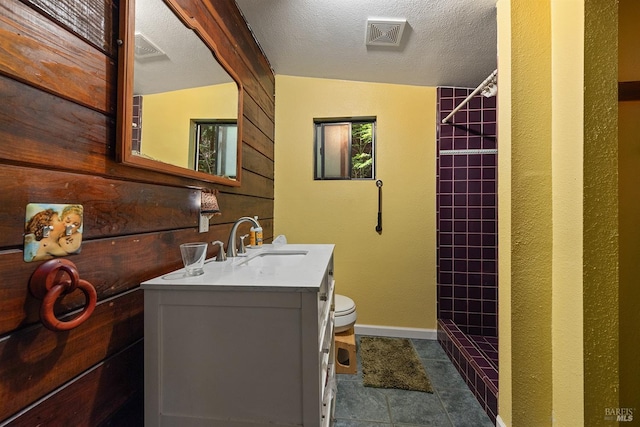 10 Wildwood Ln, Cazadero, CA 95421 - full bathroom featuring a shower stall, vanity, toilet, a textured ceiling, and baseboards