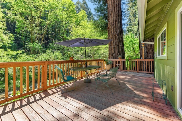 10 Wildwood Ln, Cazadero, CA 95421 - wooden terrace with outdoor dining area and a wooded view