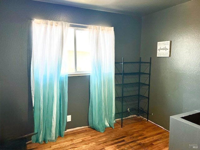 empty room featuring wood finished floors