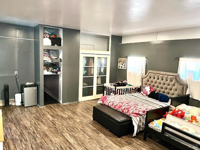 bedroom with wood finished floors