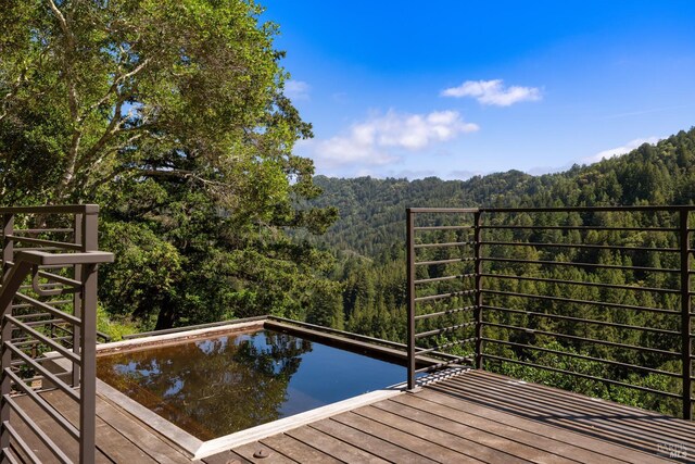 421 Crown Rd, Kentfield, CA 94904 - rear view of property featuring a balcony, board and batten siding, and a patio area