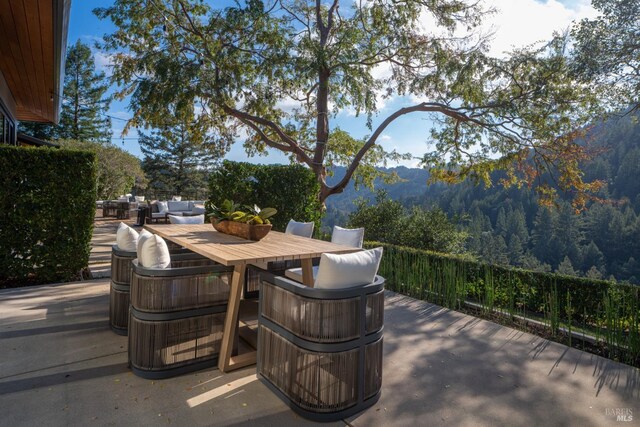 421 Crown Rd, Kentfield, CA 94904 - view of patio / terrace with outdoor dining area, an outdoor hangout area, a mountain view, and a view of trees