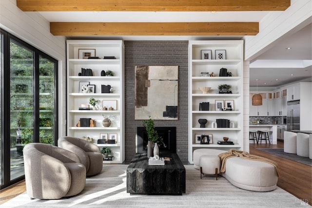 421 Crown Rd, Kentfield, CA 94904 - living area with a fireplace, beam ceiling, wood finished floors, and built in shelves