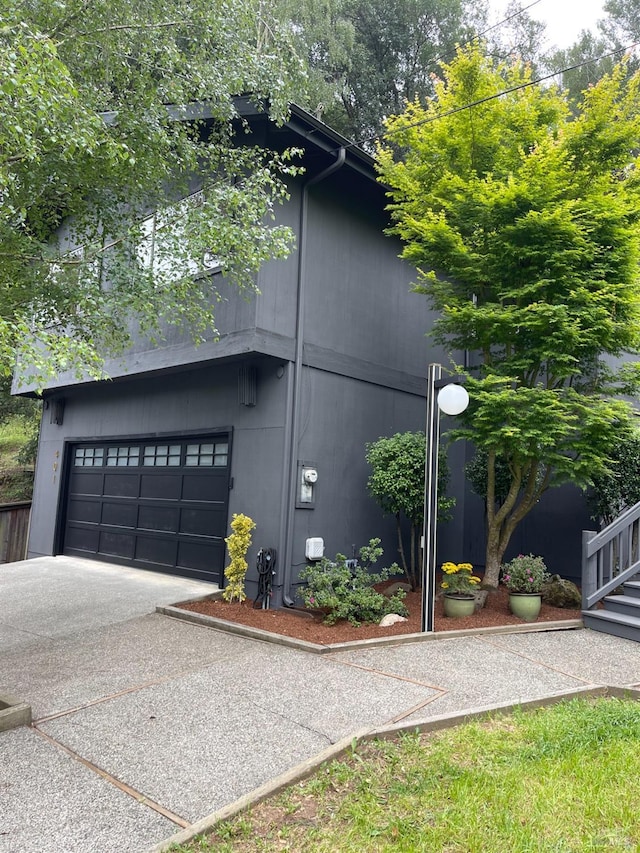 view of home's exterior with driveway and an attached garage