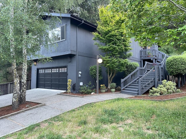 401 Sausalito St, Corte Madera, CA 94925 - view of front of home with concrete driveway, stairs, a garage, and a front lawn