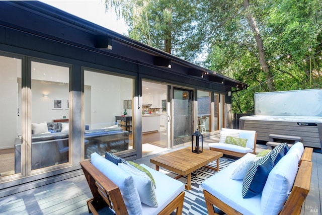 deck featuring a hot tub and an outdoor hangout area