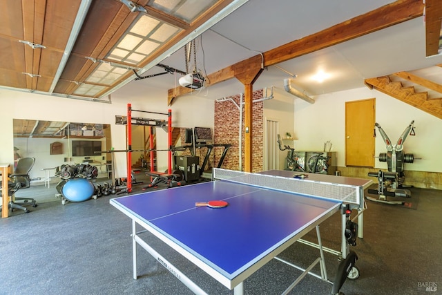 rec room featuring rubber floors and a garage