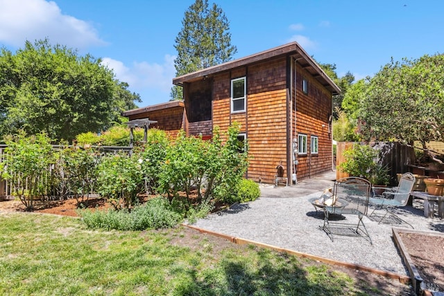 9 Buckeye Cir, Woodacre, CA 94973 - back of property with a patio, fence, and a fire pit