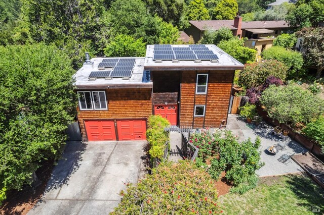 9 Buckeye Cir, Woodacre, CA 94973 - view of front facade with solar panels, driveway, fence, and a garage