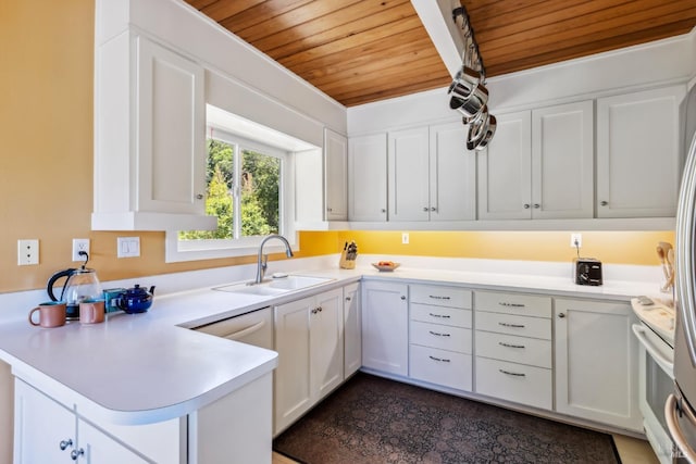 9 Buckeye Cir, Woodacre, CA 94973 - kitchen featuring a sink, wooden ceiling, a peninsula, light countertops, and white cabinets