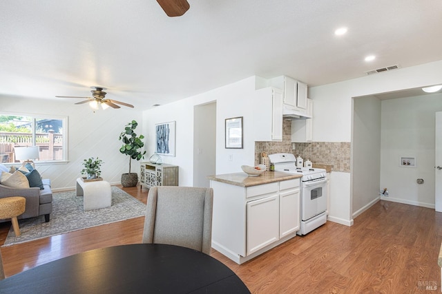 2095 W Pueblo Ave Unit A, Napa, CA 94558 - kitchen with white gas range oven, a ceiling fan, light countertops, decorative backsplash, and recessed lighting