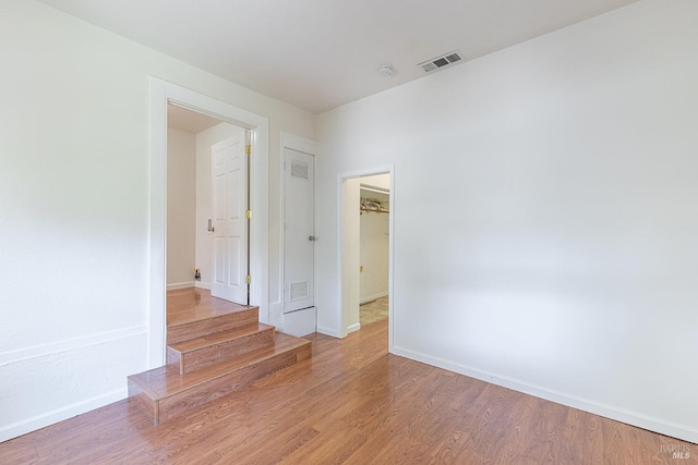 2095 W Pueblo Ave Unit A, Napa, CA 94558 - unfurnished room featuring baseboards, wood finished floors, and stairs