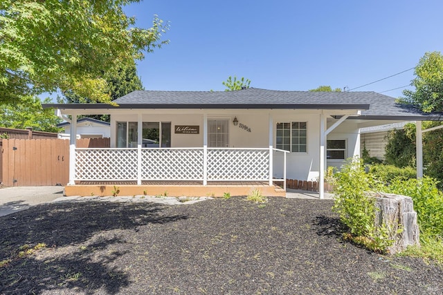 2095 W Pueblo Ave Unit A, Napa, CA 94558 - bungalow-style home featuring a porch, a shingled roof, fence, and stucco siding