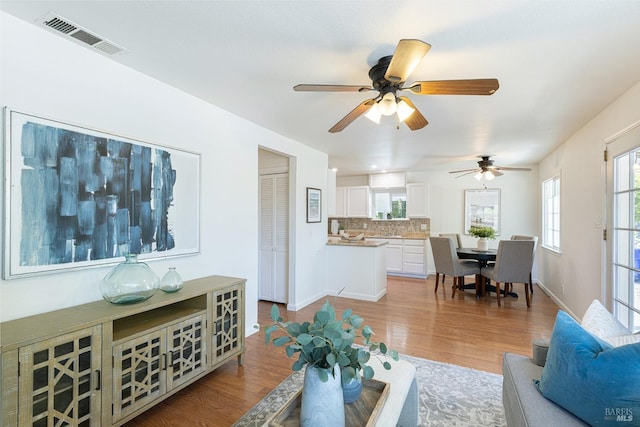 2095 W Pueblo Ave Unit A, Napa, CA 94558 - living area featuring wood finished floors, a ceiling fan, and baseboards