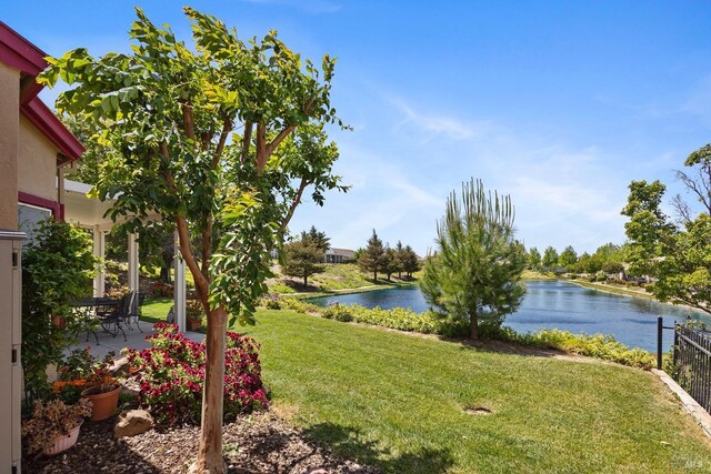 573 Laurel Pl, Rio Vista, CA 94571 - view of grassy yard with a water view and a patio area