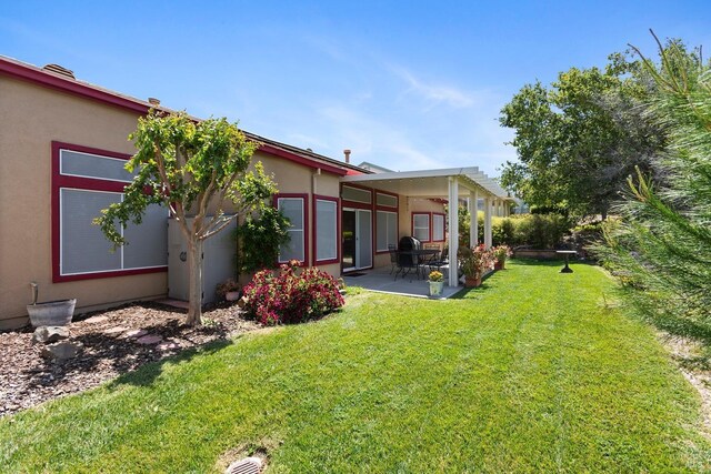573 Laurel Pl, Rio Vista, CA 94571 - back of house with a patio area, a yard, and stucco siding