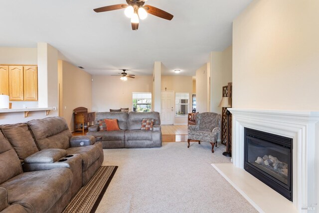 573 Laurel Pl, Rio Vista, CA 94571 - living area with a ceiling fan, a glass covered fireplace, and light carpet