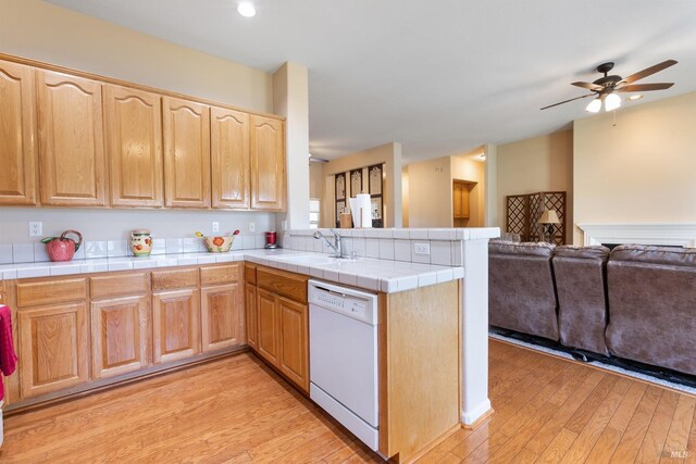 573 Laurel Pl, Rio Vista, CA 94571 - kitchen with white dishwasher, a sink, open floor plan, ceiling fan, and a peninsula