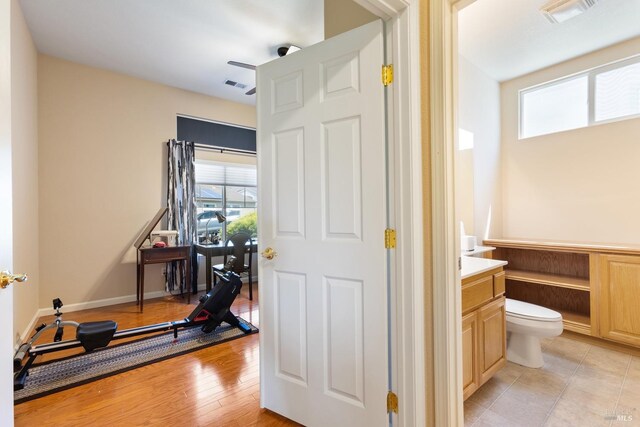 573 Laurel Pl, Rio Vista, CA 94571 - bathroom with healthy amount of natural light, vanity, toilet, and wood finished floors