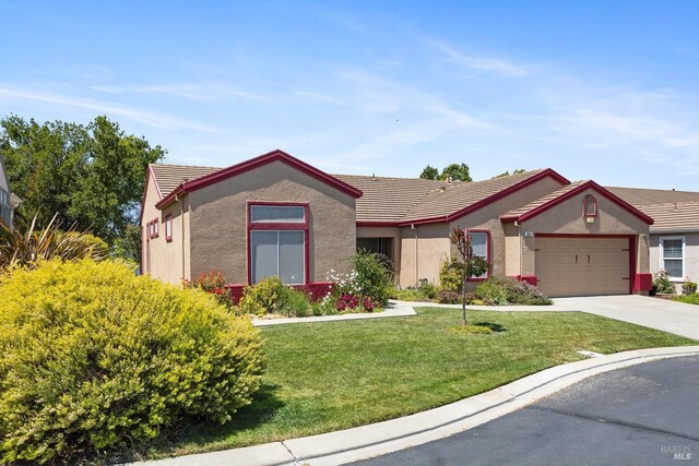 573 Laurel Pl, Rio Vista, CA 94571 - ranch-style home with a garage, a front lawn, driveway, and stucco siding