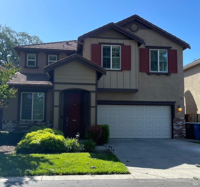 craftsman house with brick siding, an attached garage, concrete driveway, and stucco siding