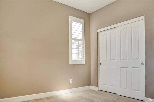 566 Chaparral Loop, Vacaville, CA 95688 - unfurnished bedroom featuring light colored carpet, baseboards, and a closet