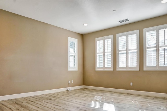 566 Chaparral Loop, Vacaville, CA 95688 - spare room with healthy amount of natural light, baseboards, light wood-style flooring, and recessed lighting