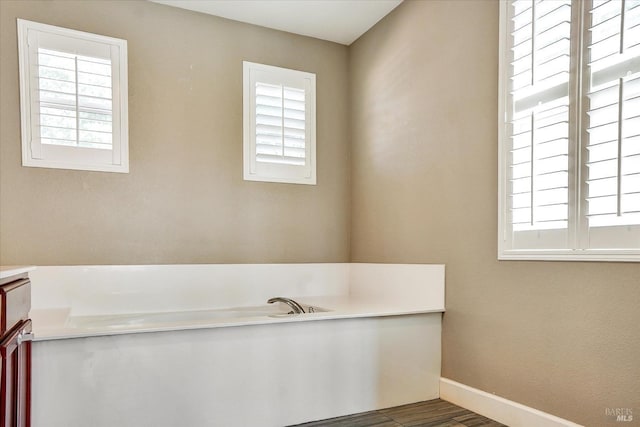 566 Chaparral Loop, Vacaville, CA 95688 - full bathroom featuring plenty of natural light, baseboards, a bath, and wood finished floors