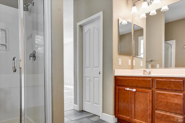 566 Chaparral Loop, Vacaville, CA 95688 - bathroom with a shower stall, vanity, and baseboards