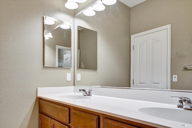 566 Chaparral Loop, Vacaville, CA 95688 - bathroom featuring double vanity and a textured wall