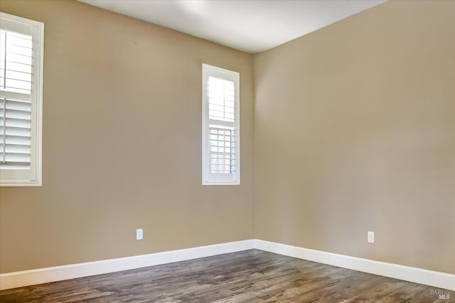 566 Chaparral Loop, Vacaville, CA 95688 - unfurnished room featuring baseboards and dark wood-type flooring