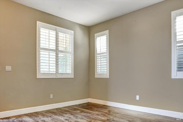 566 Chaparral Loop, Vacaville, CA 95688 - empty room with baseboards and wood finished floors